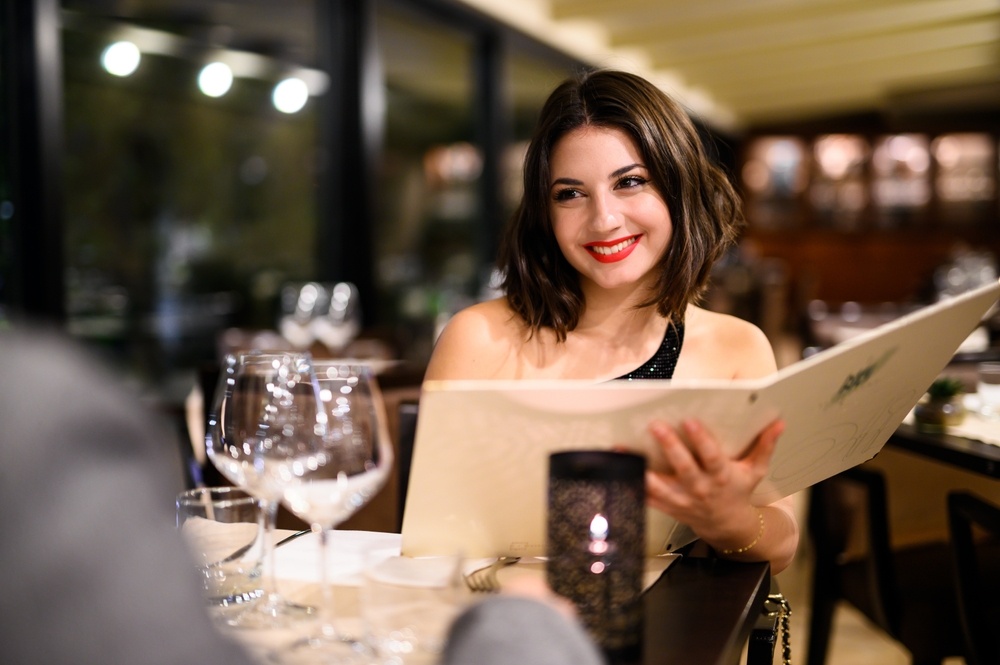 A woman ready to dine at a Michelin star restaurant in Phuket 