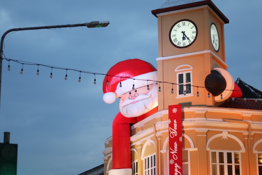 Giant inflatable Santa atop a building in Phuket Town