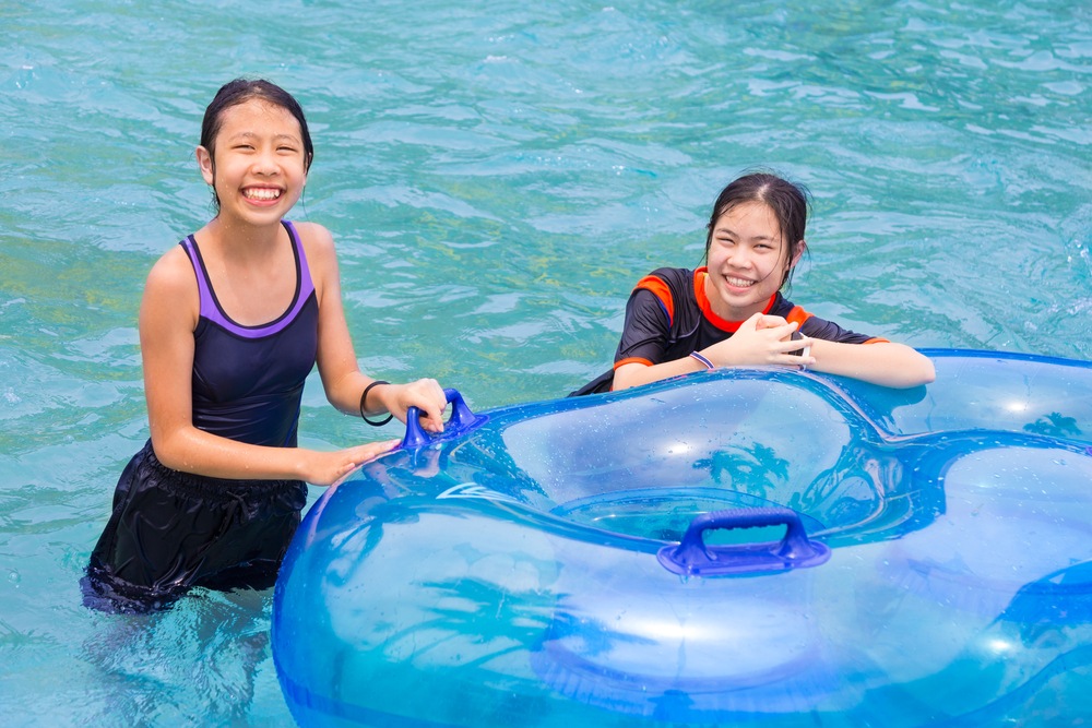 Teenagers enjoying the lazy river at Andamanda Phuket, one of the teen-friendly things to do in Phuket.