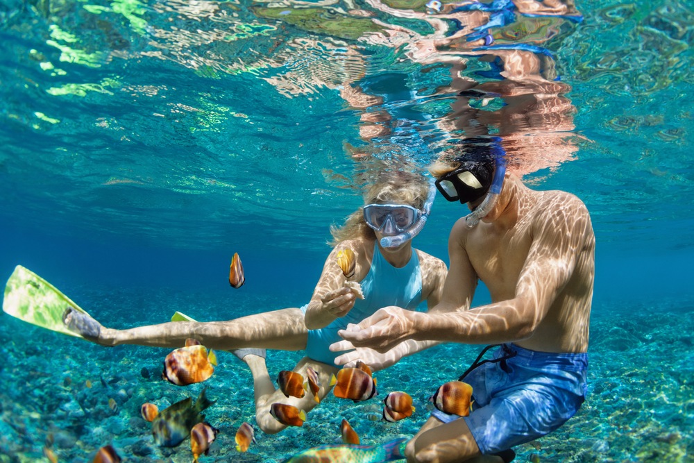 Teenagers snorkeling and checking out marine life. One of the popular Phuket activities for teens.