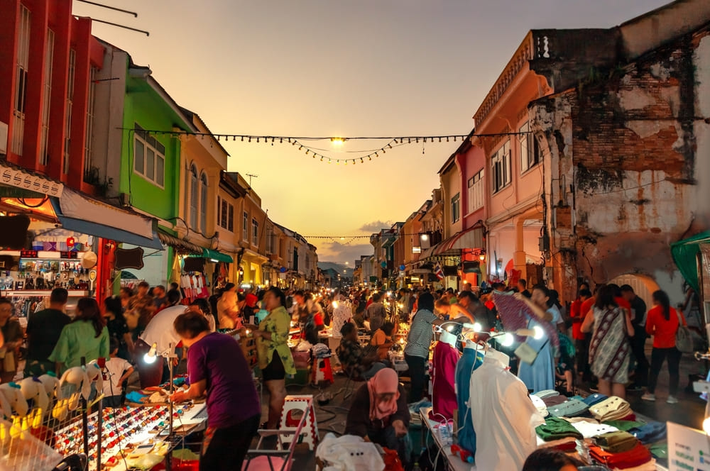 vendors in Phuket Town set up a market selling clothes, crafts, and food