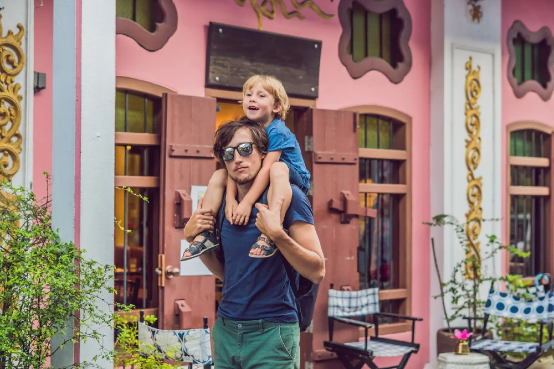 A father and son strolling in Old Town Phuket