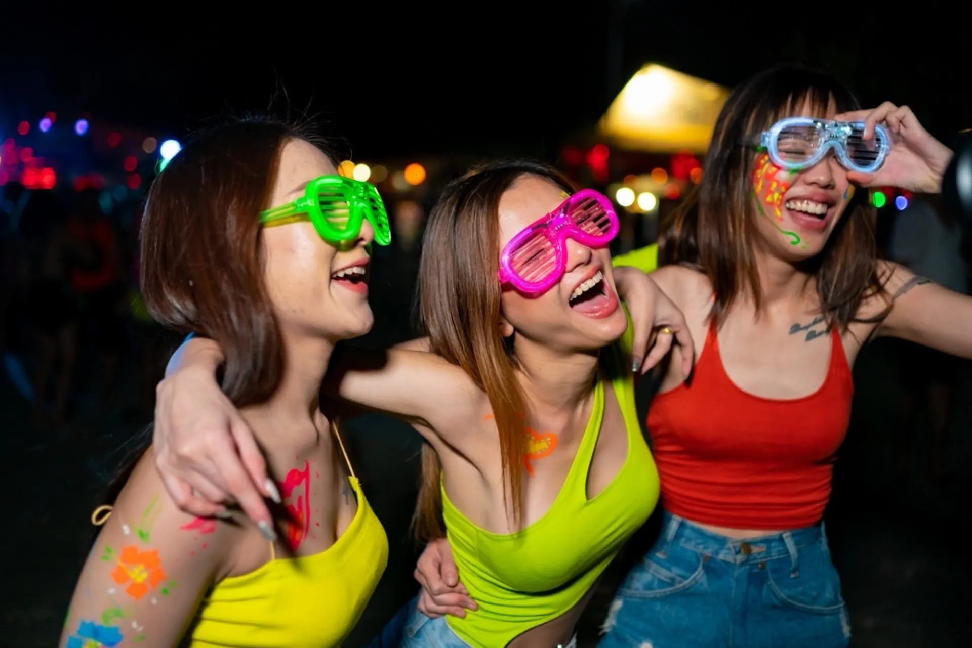 A group of friends having fun at the Phuket full moon party 